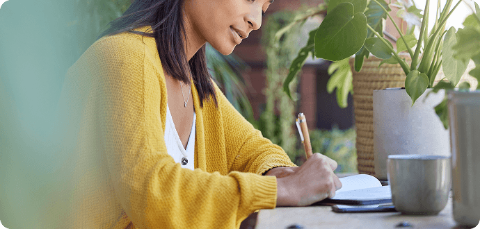 A woman writing in her diary