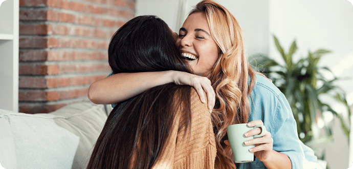 Two friends hugging each other